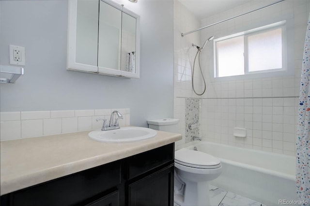 full bathroom featuring vanity, shower / tub combo, toilet, and marble finish floor