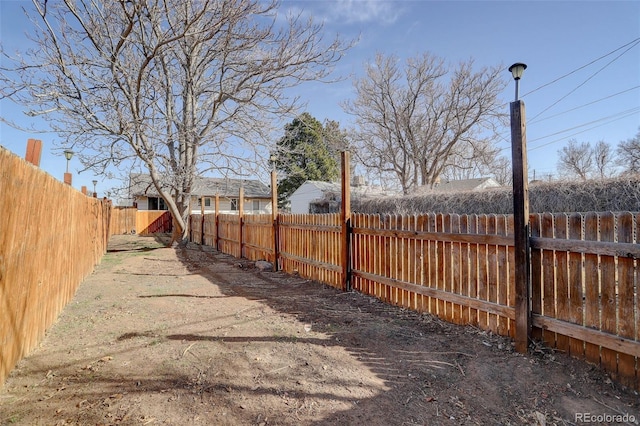 view of yard with a fenced backyard