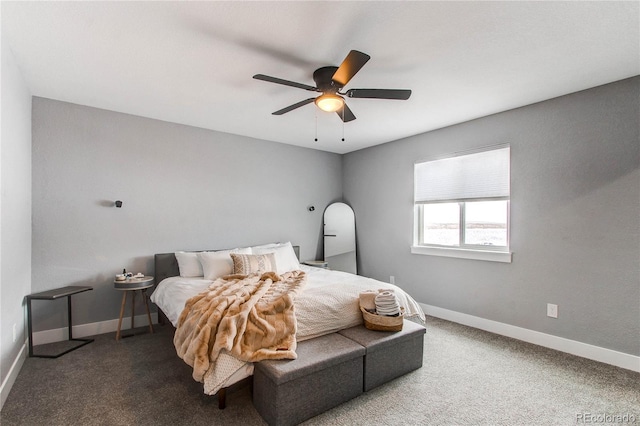 carpeted bedroom featuring a ceiling fan and baseboards