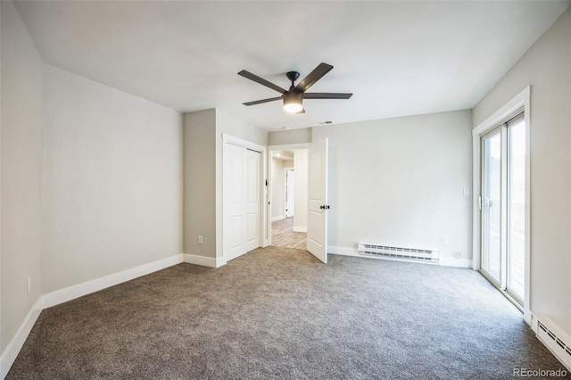 unfurnished bedroom featuring carpet floors, access to outside, and baseboard heating