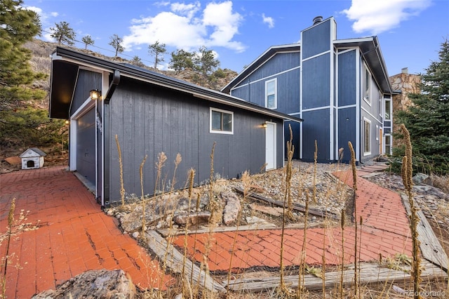 view of property exterior featuring a garage