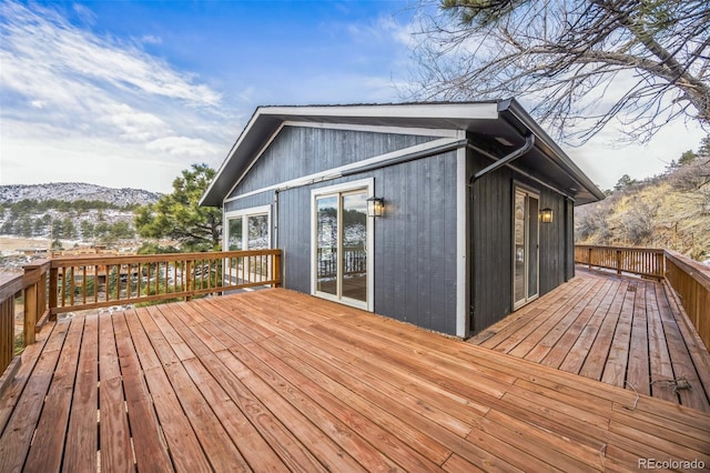 wooden deck featuring a mountain view