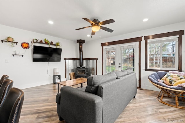 741 Cortez St, Denver, CO 80221 - living room featuring a ceiling fan, recessed lighting, french doors, and a wood stove