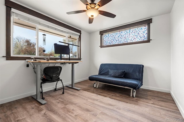 741 Cortez St, Denver, CO 80221 - living area featuring baseboards, ceiling fan, and wood finished floors