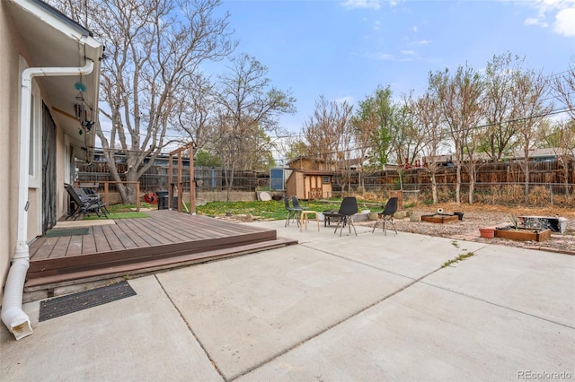 741 Cortez St, Denver, CO 80221 - view of patio / terrace featuring a fenced backyard, a shed, an outbuilding, and a deck