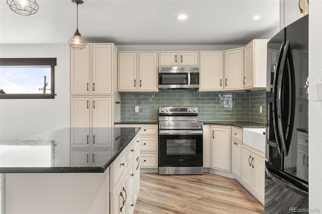 741 Cortez St, Denver, CO 80221 - kitchen featuring stainless steel appliances, backsplash, light wood-style floors, decorative light fixtures, and recessed lighting