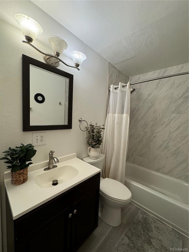 bathroom featuring shower / bath combo, toilet, wood finished floors, a textured ceiling, and vanity