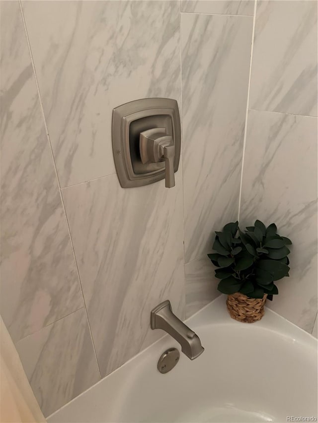 details with walk in shower and a bath