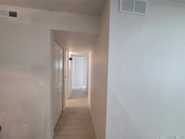 14433 E Jewell Ave Unit 101, Aurora, CO 80012 - hallway featuring light wood-style flooring and baseboards