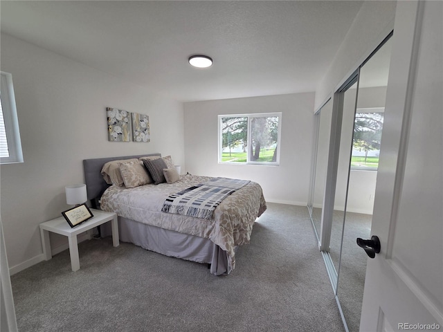 14433 E Jewell Ave Unit 101, Aurora, CO 80012 - carpeted bedroom with baseboards