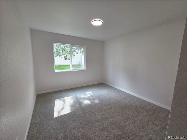 14433 E Jewell Ave Unit 101, Aurora, CO 80012 - carpeted spare room with baseboards