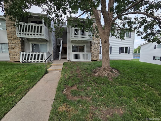 14433 E Jewell Ave Unit 101, Aurora, CO 80012 - view of front of home with a front yard