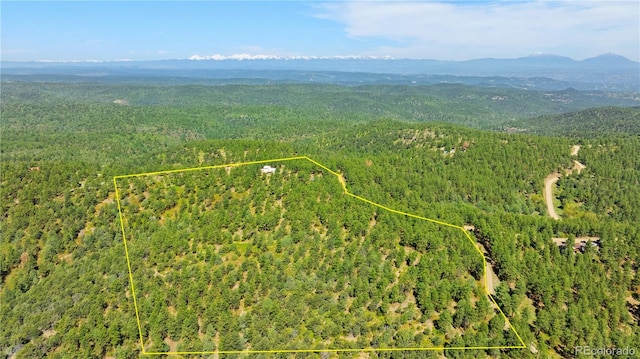 33002 Bobcat Ct, Trinidad, CO 81082 - aerial view of property's location with a forest, a mountainous background, and property parcel outlined