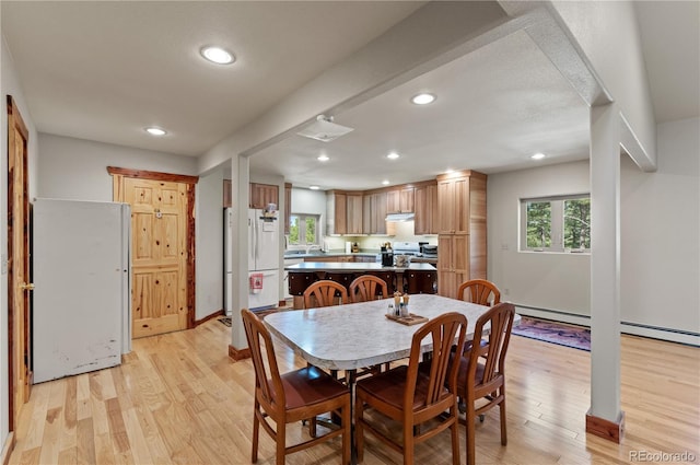 33002 Bobcat Ct, Trinidad, CO 81082 - dining room with recessed lighting, light wood-style floors, a baseboard heating unit, and baseboards