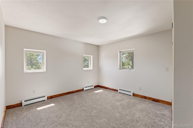 33002 Bobcat Ct, Trinidad, CO 81082 - empty room with baseboard heating, carpet floors, and baseboards