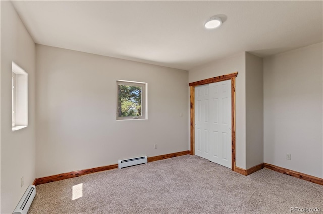 33002 Bobcat Ct, Trinidad, CO 81082 - unfurnished bedroom featuring a baseboard heating unit, carpet flooring, baseboards, and a closet