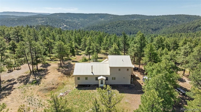 33002 Bobcat Ct, Trinidad, CO 81082 - view of subject property with a heavily wooded area and a mountain backdrop
