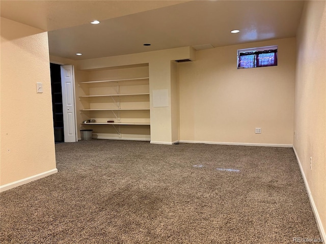 below grade area featuring recessed lighting, baseboards, and carpet floors