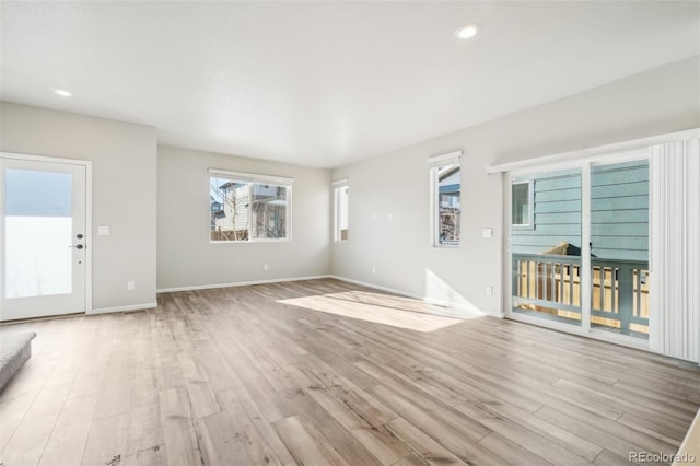 unfurnished living room with light hardwood / wood-style floors