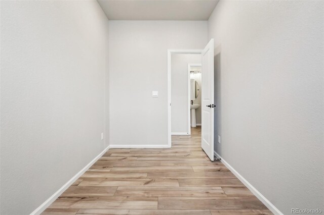 hallway featuring light wood-type flooring