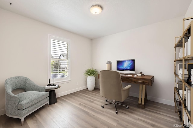8778 S Quatar St, Aurora, CO 80016 - office area featuring baseboards and wood finished floors