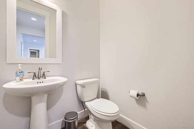 8778 S Quatar St, Aurora, CO 80016 - bathroom with toilet and wood finished floors