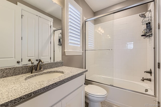 8778 S Quatar St, Aurora, CO 80016 - bathroom with vanity and bath / shower combo with glass door