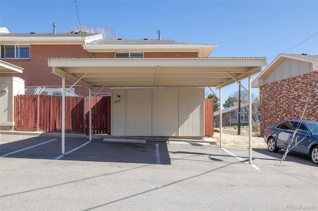covered parking lot with fence