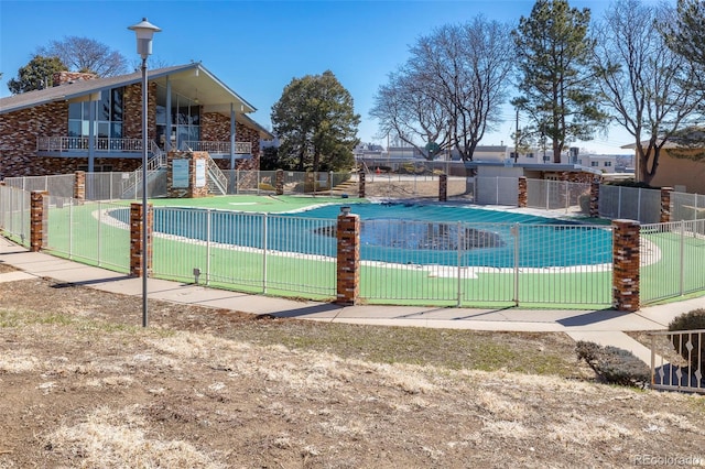 view of pool featuring fence and a fenced in pool