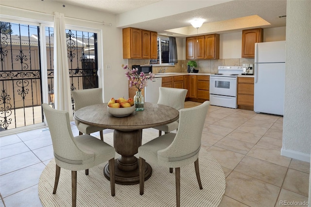 dining room featuring light tile patterned flooring