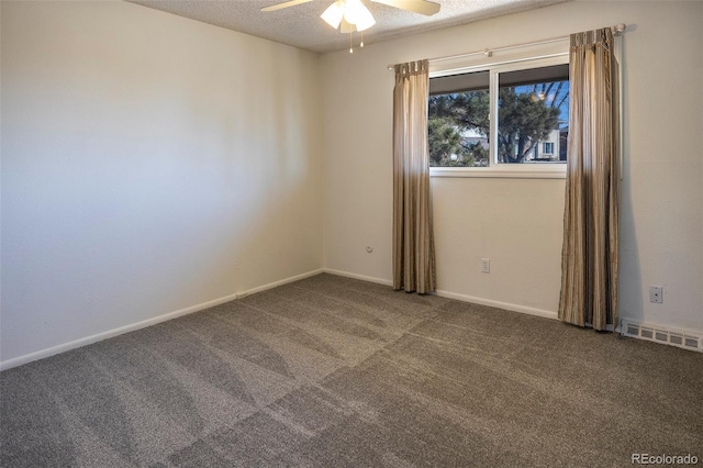 unfurnished room featuring a textured ceiling, visible vents, carpet flooring, a ceiling fan, and baseboards