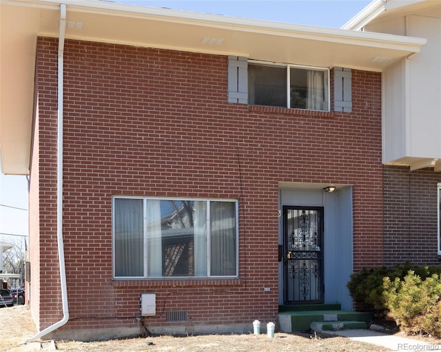 view of front of home with brick siding