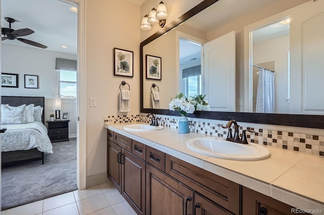 9453 Vista Hill Ln, Lone Tree, CO 80124 - full bath with double vanity, ceiling fan, ensuite bathroom, and decorative backsplash