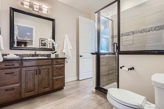 9453 Vista Hill Ln, Lone Tree, CO 80124 - bathroom featuring vanity, a stall shower, and wood finished floors