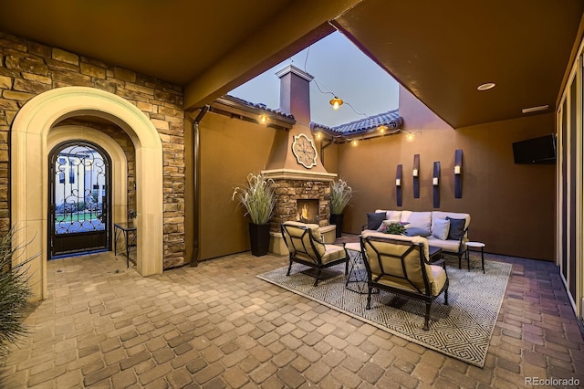 9453 Vista Hill Ln, Lone Tree, CO 80124 - view of patio / terrace with an outdoor living space with a fireplace