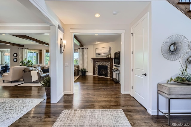 9453 Vista Hill Ln, Lone Tree, CO 80124 - foyer entrance with a fireplace, dark wood-style flooring, and recessed lighting