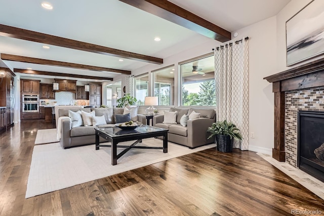 9453 Vista Hill Ln, Lone Tree, CO 80124 - living area with a fireplace, wood finished floors, beamed ceiling, and recessed lighting