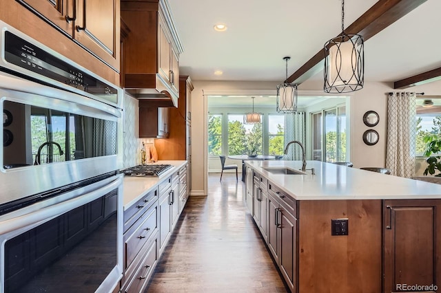 9453 Vista Hill Ln, Lone Tree, CO 80124 - kitchen with stainless steel appliances, healthy amount of natural light, light countertops, and recessed lighting