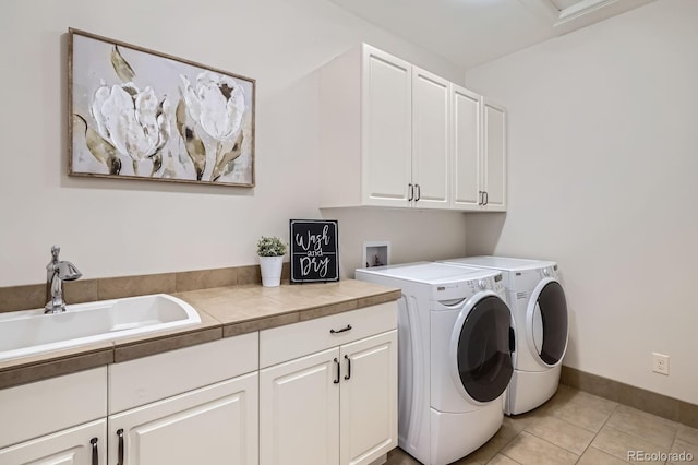 9453 Vista Hill Ln, Lone Tree, CO 80124 - laundry room with cabinet space, washing machine and clothes dryer, and light tile patterned floors
