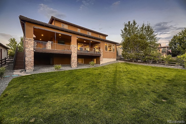 9453 Vista Hill Ln, Lone Tree, CO 80124 - back of house featuring stucco siding, stone siding, and stairway