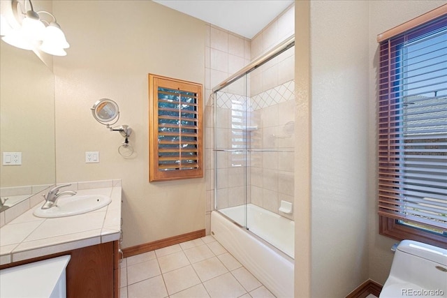 6703 S Yates Ct, Littleton, CO 80128 - full bath featuring vanity, tile patterned flooring, enclosed tub / shower combo, and a chandelier