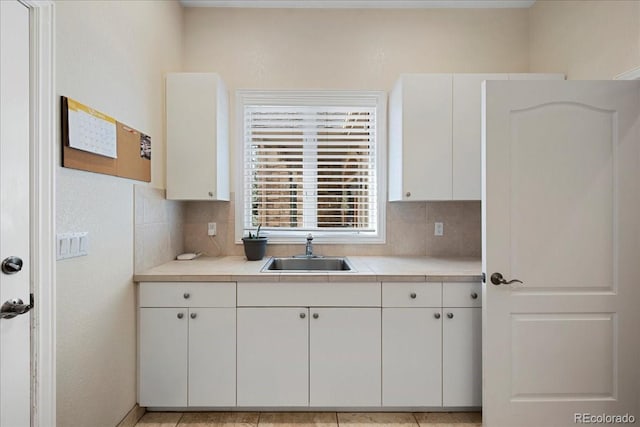 6703 S Yates Ct, Littleton, CO 80128 - kitchen with tasteful backsplash and white cabinetry