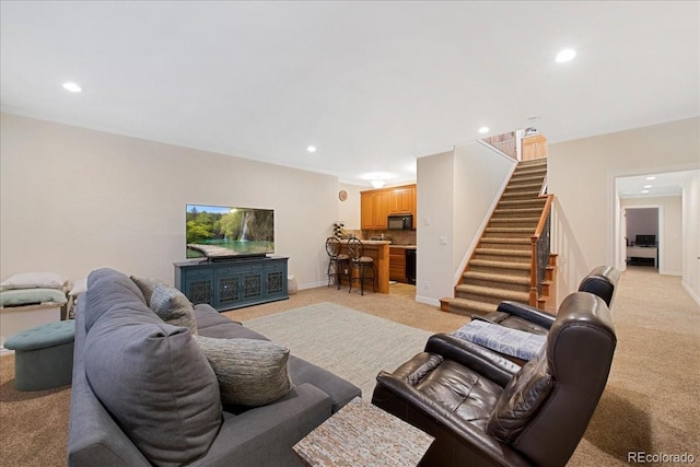 6703 S Yates Ct, Littleton, CO 80128 - living area with light carpet, stairway, and recessed lighting