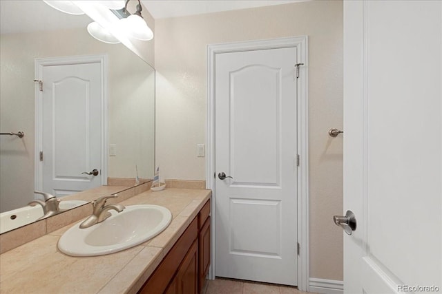 6703 S Yates Ct, Littleton, CO 80128 - bathroom featuring vanity and tile patterned floors