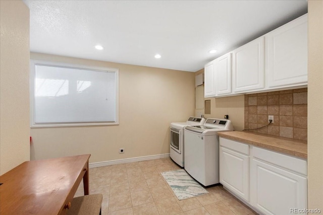 6703 S Yates Ct, Littleton, CO 80128 - laundry room featuring separate washer and dryer, cabinet space, recessed lighting, and light tile patterned floors