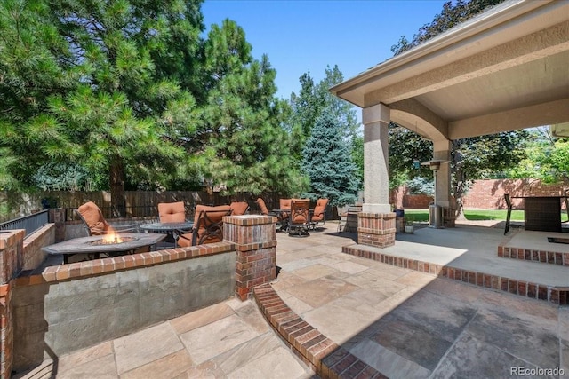 6703 S Yates Ct, Littleton, CO 80128 - view of patio / terrace with a fire pit
