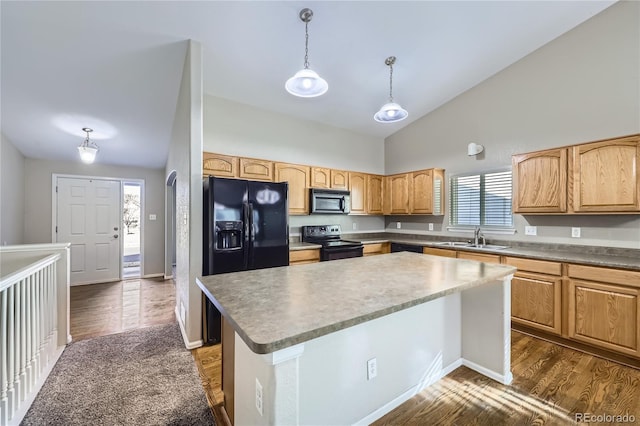 kitchen featuring sink, hanging light fixtures, black appliances, a kitchen island, and dark hardwood / wood-style flooring