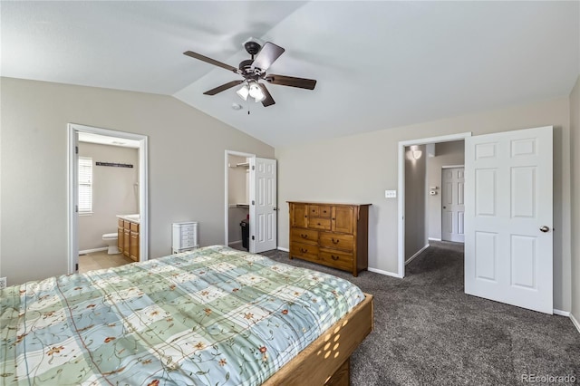 carpeted bedroom with lofted ceiling, ceiling fan, ensuite bathroom, a walk in closet, and a closet