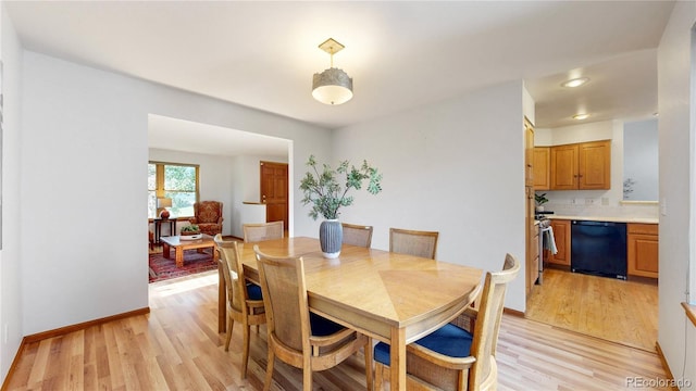 14633 W 69th Pl, Arvada, CO 80004 - dining area with light wood finished floors and baseboards