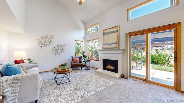 14633 W 69th Pl, Arvada, CO 80004 - living area featuring high vaulted ceiling, carpet floors, and a brick fireplace